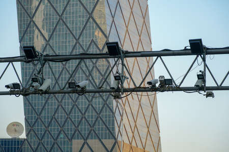 CCTV surveillance street cameras with CCTV tower on the background. Traffic and people security camera, Big brother. Beijing, China. . April 5th, 2020のeditorial素材