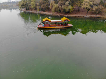 Aerial view of old Chinese boat on the lake inside the Imperial Summer Palace of The Mountain Resort, UNESCO World Heritage. Chengde. China. Chinese ancient old style boat. April 10th, 2020のeditorial素材