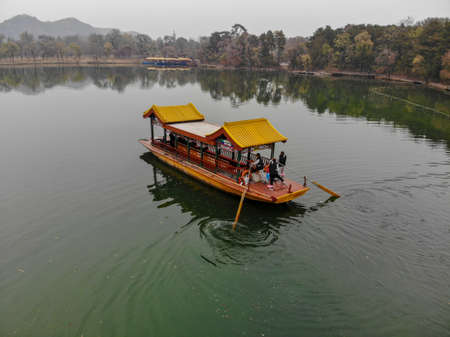 Aerial view of old Chinese boat on the lake inside the Imperial Summer Palace of The Mountain Resort, UNESCO World Heritage. Chengde. China. Chinese ancient old style boat. April 10th, 2020のeditorial素材