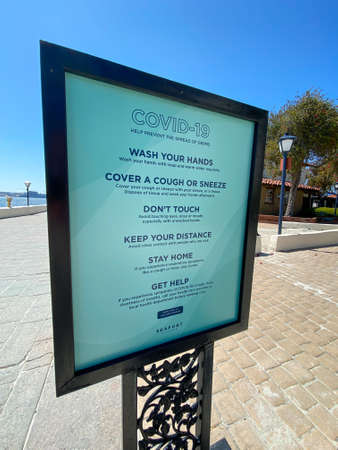 Empty sea port of San Diego with informative signage during COVID-19 pandemic. Coronavirus virus panic and quarantine San Diego, USA, April 18th, 2020のeditorial素材