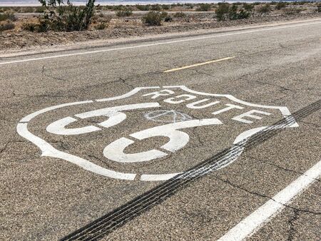 The famous Route 66 emblem painted on Route 66 in the California Desert. USA