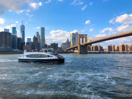 Waterway Boat at Lower Manhattan, next to Brooklyn Bridge, New York. Waterway is a private transportation company running ferry and bus service in New York, USA, October 22nd, 2019のeditorial素材
