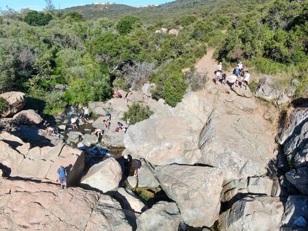 Aerial view of Los Penasquitos Canyon Preserve with the creek waterfall and people enjoying the water. Urban park with trails and river in San Diego, California. USAの写真素材
