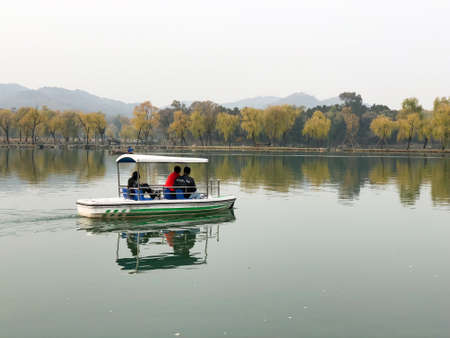 People are taking a recreational boat ride on the lake inside the Imperial Summer Palace of the Mountain Resort in Chengde. China. December 13th, 2019のeditorial素材