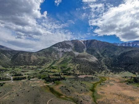Aerial view of green land valley and mountain in Aspen Springs, Mono County California, USAの写真素材