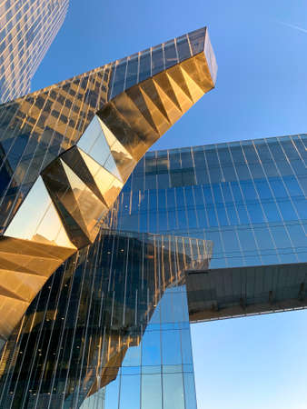 Modern skyscraper building against blue sky in Barcelona, Spain. June 20th, 2020のeditorial素材