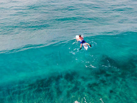 Aerial view of surfers waiting, paddling and enjoying waves in a beautiful blue water in La Jolla, San Diego, California, USA. July 1st, 2019のeditorial素材
