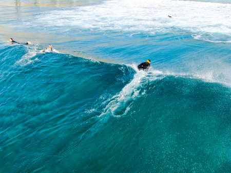 Aerial view of surfers waiting, paddling and enjoying waves in a beautiful blue water in La Jolla, San Diego, California, USA. July 1st, 2019のeditorial素材