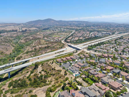 Aerial view of middle class subdivision neighborhood with residential villas and mountain on the...