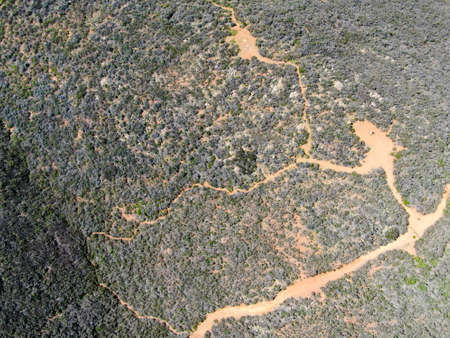 Aerial top view of Black Mountain in Carmel Valley, San Diego, California, USA. Green dry mountain during with hiking trails, perfect for hiking .の写真素材