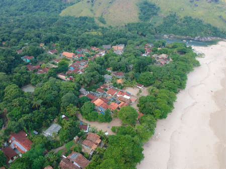Aerial view of white sandy beach in tropical country. Sandy tropical beach with palm trees. holiday...