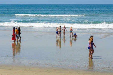 Tourist and families on the beach enjoying beautiful summer day at Huntington Beach, California. USA July 13th, 2020のeditorial素材