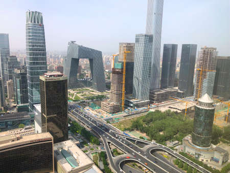 Towers in Central Business District of Beijing with CITIC Tower super tall skyscraper on background...