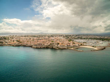 Aerial view of Antibes city and port during summer day. Antibes is a city located on the French Riviera or Cote dAzur in France. Europeの写真素材