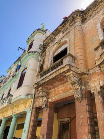 Street scene with colorful and old building on Havana. Urban scene with people and aged buildings in Old Havana. Cuba. February 21st, 2020のeditorial素材