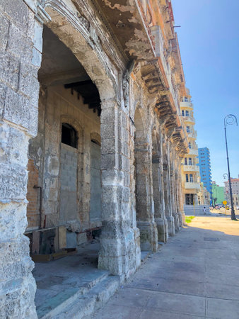 Street scene with colorful and old building on Havana. Urban scene with people and aged buildings in Old Havana. Cuba. February 21st, 2020のeditorial素材