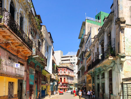 Street scene with colorful and old building on Havana. Urban scene with people and aged buildings in Old Havana. Cuba. February 21st, 2020のeditorial素材