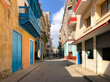 Street scene with colorful and old building on Havana. Urban scene with people and aged buildings in Old Havana. Cuba. February 21st, 2020のeditorial素材