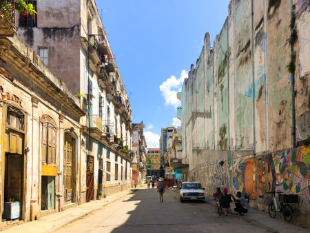 Street scene with colorful and old building on Havana. Urban scene with people and aged buildings in Old Havana. Cuba. February 21st, 2020のeditorial素材