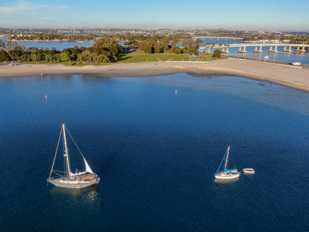 Aerial view of small sail boats in the Mission Bay of San Diego, California, USA. Small sailing ship yachts anchored in the bay. March 22nd, 2020のeditorial素材
