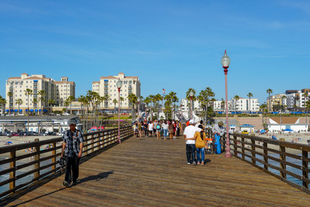 Tourist walking on the Oceanside Pier during blue summer day, Oceanside, northern San Diego, California. Wooden pier on the western United States coastline. Famous for fisher. Febraury 22n, 2020のeditorial素材