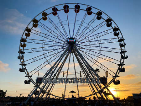 Ferris wheel, bottom view of a Ferris wheel during sunset. San DIego County Fair, California, USA. July 13thのeditorial素材