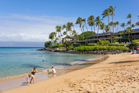 Tourist enjoying tropical beach with white sand and crystal clear water in Maui, Hawaii, USA, August 22nd, 2021のeditorial素材