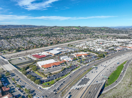 Aerial view over San Juan Capistrano, California, featuring the historic mission, library, sports...