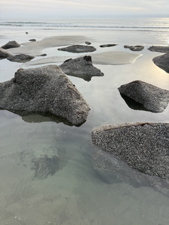 Stunning view at beach with coastal rocks and clear ocean water. High quality photo