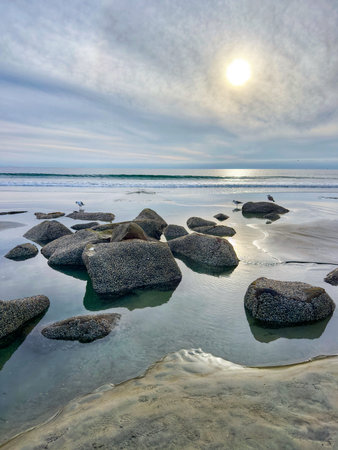 Stunning view at beach with coastal rocks and clear ocean water. High quality photo