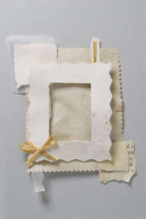 Paper frame made of pieces of paper with a little bowの写真素材