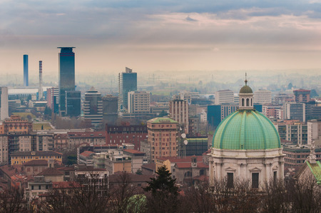 A view of Brescia, Lombardy, Italy. In foreground, the cathedral of the city.の写真素材