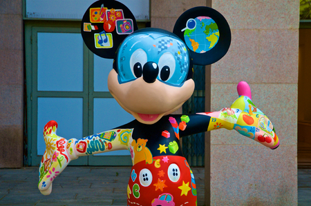 MILAN, ITALY - MAY 7: A figure of Mickey Mouse dressed with many colors and drawings. The statue is part of an artist exposition at the Triennale in May 7, 2016 at Milan, Italy.のeditorial素材
