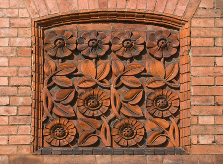 Attractive floral tiled plaque blocking up an old windowの写真素材