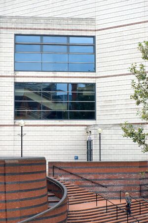 Curved steps leading up to a modern office buildingの写真素材
