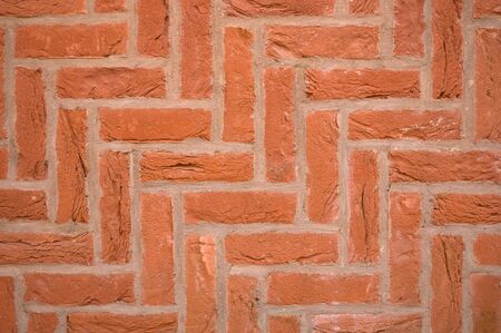Brick wall using a diagonal herringbone pattern bondの写真素材