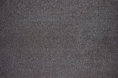 Grungy black cotton denim fabric textureの写真素材