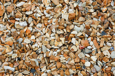 Pebbles on a beach washed smooth by the sea.の写真素材