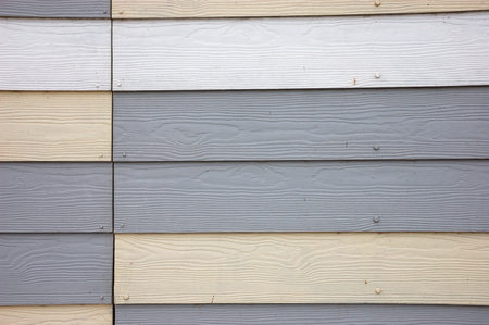 Grey and cream wood effect textured pvc claddingの写真素材