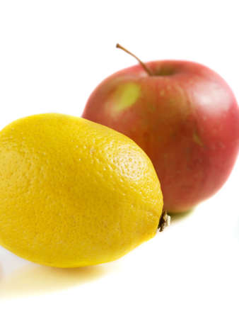 Lemon and apple isolated on white backgroundの写真素材