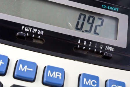 Professional business calculator with the number 0.92 on the screenの写真素材