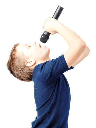 Boy singing into a microphone. Very emotional.の写真素材