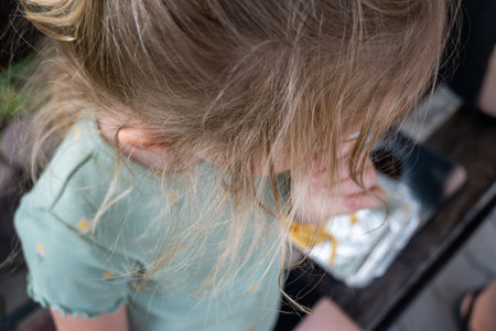 Loose curly hair of a little girl, top view. Blonde hair. High quality photoの写真素材