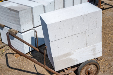 Transportation and storage of aerated concrete blocks, bricks. Laying aerated concrete blocks. Construction of aerated concrete blocks, bricks. High quality photoの写真素材