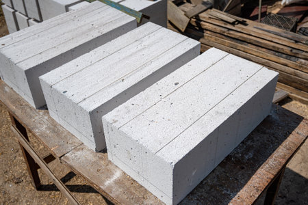 White aerated concrete blocks close-up. Laying aerated concrete blocks. Construction of a house from aerated concrete blocks and bricks. High quality photoの写真素材