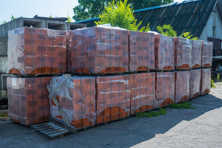 Packed red bricks stacked in a row. High quality photoの写真素材