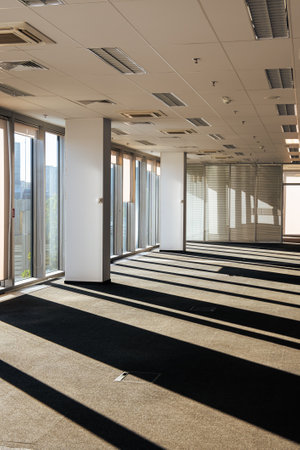Empty long passageway in modern building. Corporate or company apartment with coworking commercial...