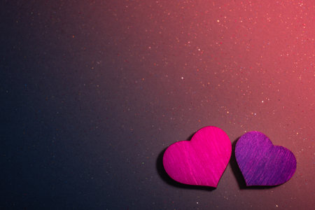Hearts on a dark warm background with sparkles,symbol of love,happy woman, mother, Valentines Day,...