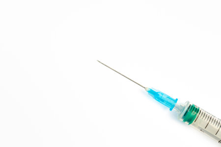 Close-up of a syringe isolated on a white background. Medical concept medicine. Syringe, medical injection.の写真素材