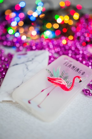 Christmas floral bokeh background with cover for iPhone with flamingo